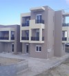 White frames and doors for a block of flats in Kos